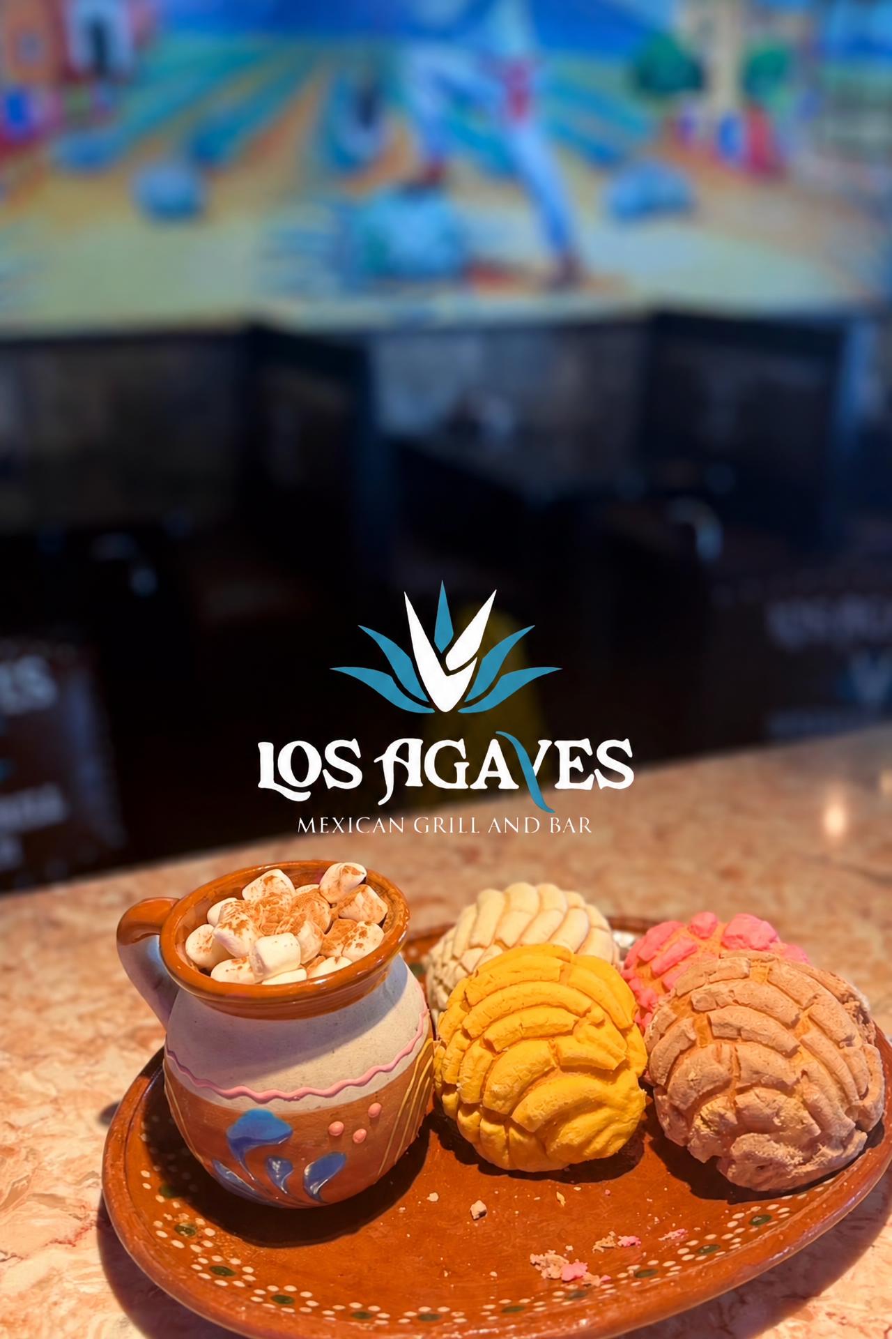 Mexican hot chocolate with marshmallows and colorful conchas